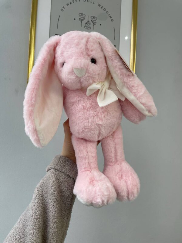 Рожевий плюшевий зайчик з довгими вушками та світлим бантиком